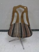 A mid 20th century perspex backed dining chair on swivel base by Barget