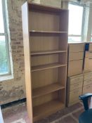 A beech effect bookcase, width 79.5 cm x height 203.5 cm.