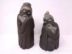 Two Lladro figures of sleeping Chinese elders in matte finish