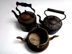 Two antique copper kettles together with a copper and brass Middle Eastern pot with handle