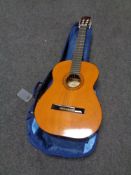 A Hohner MC-05 acoustic guitar in carry bag