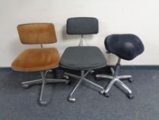 Two continental swivel office typist's chairs together with a typist's stool