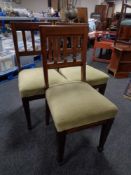 A set of three Edwardian mahogany rail back dining chairs