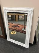 A contemporary white framed mirror 76 x 106 cm