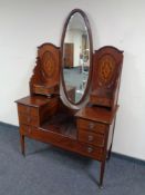A late Victorian inlaid mahogany sunk centre dressing table with mirror