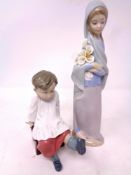 A Lladro figure, boy in cassock seated with bird on foot, together with a further Lladro figure,