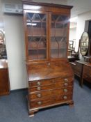 A 19th century mahogany bureau bookcase fitted four drawers beneath