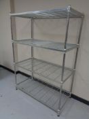 A set of metal four tier racking with wire metal shelves
