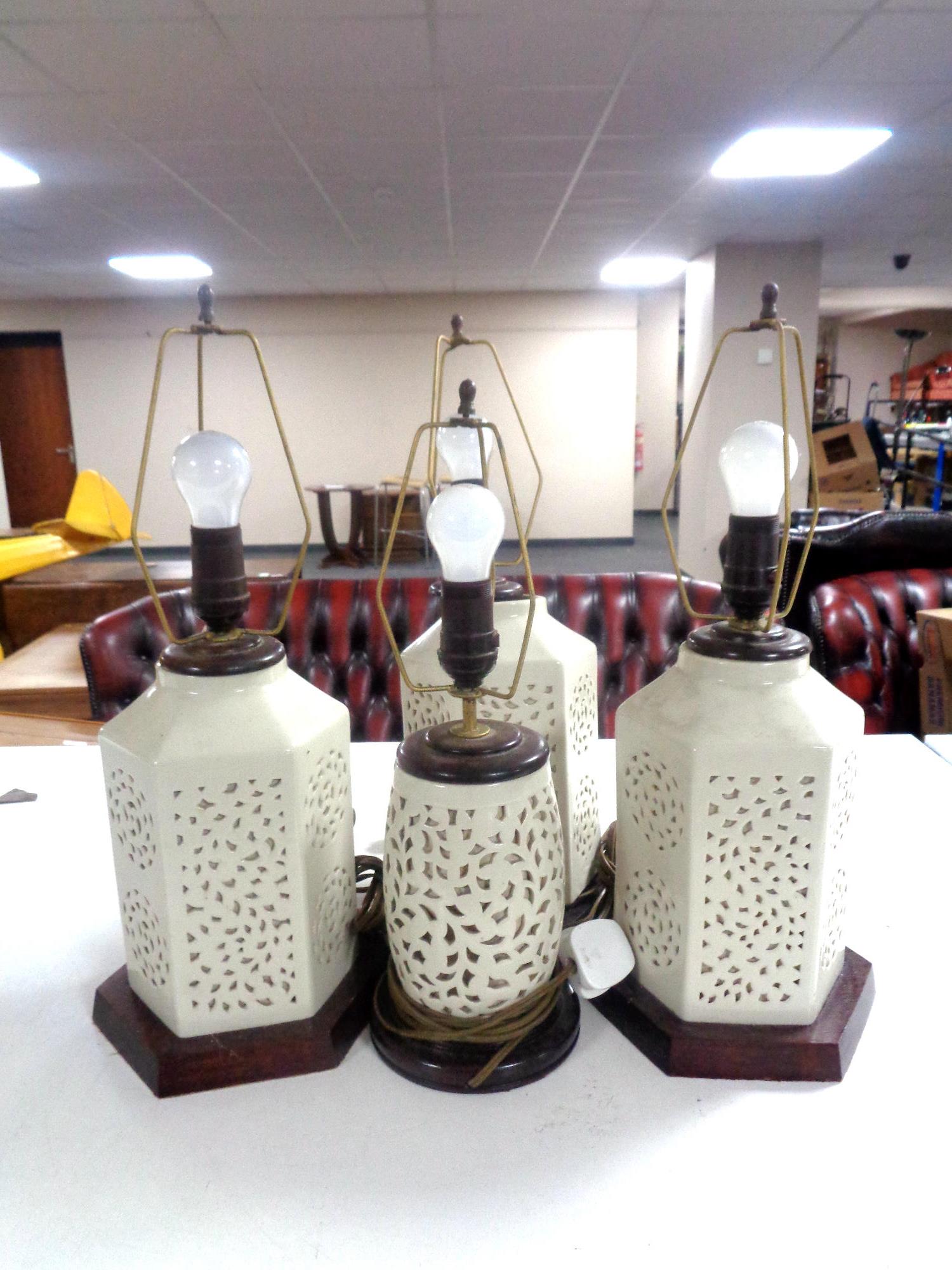 Four Chinese style pottery table lamps on wooden bases