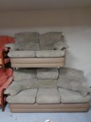 A fabric and leather two tone three seater settee with two seater settee