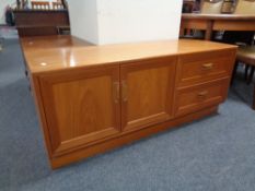 A 20th century G-Plan teak low double door sideboard fitted two drawers,