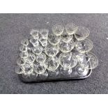 A tray containing antique etched glass drinking glasses