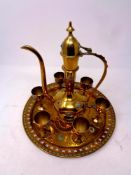 An Eastern brass eight piece serving set comprising of teapot,