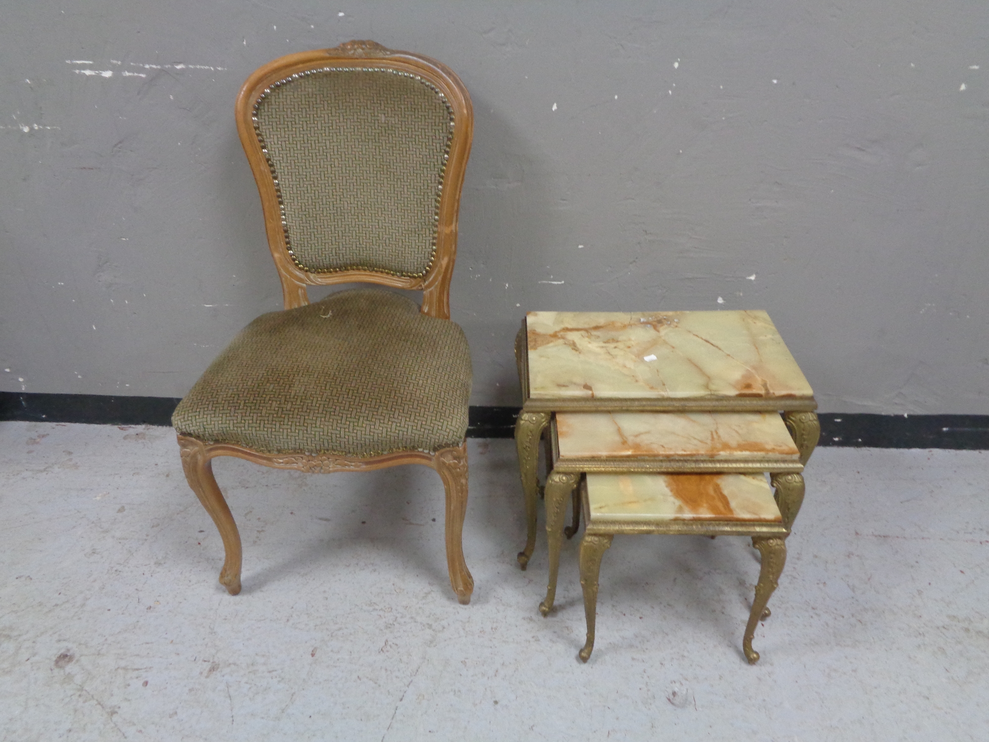 A nest of three onyx topped tables (a/f),