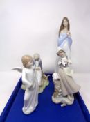 A tray containing four assorted Spanish figures to include Nao figure,