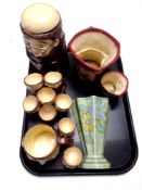 A tray containing assorted pottery items to include Fryer lidded storage jar,