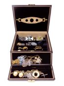 A leather Dulwich jewellery box containing costume jewellery to include beaded necklaces, bangles,