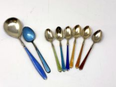 A set of six silver-gilt and enamelled teaspoons together with two other similar spoons