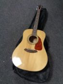 A Fender CD-1405 acoustic guitar in carry bag