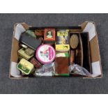 A box containing vintage tins, eight Pan paperback James Bond novels, coinage, clothes brushes,