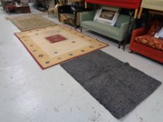 A Next shaggy pile rug together with two other rugs