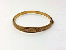 A 9ct gold hinged bangle CONDITION REPORT: 5.