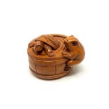 A carved Chinese hardwood netsuke - Tortoise and frog in barrel