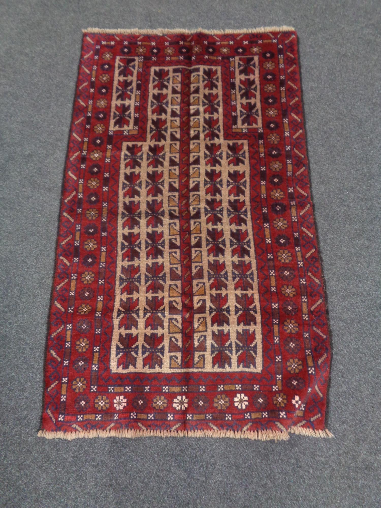A Baluchi rug 129cm by 76cm