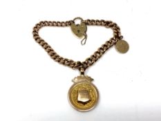 A 9ct gold padlock bracelet with fob marked Order of Druids Newcastle Equalised District