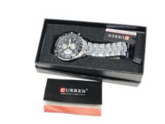 A gent's Curren stainless steel quartz calendar wristwatch, boxed.