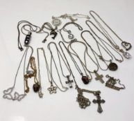 Fifteen various silver and white metal pendants on chains (15)
