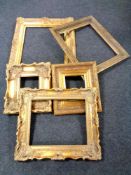 A 19th century gilt and gesso frame picture together with four further contemporary gilt frames