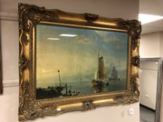 A 20th century colour print, depicting fishing boats, in an ornate gilt frame,