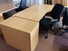 A beech effect desk, width 180 cm, together with four drawer oak chest and black swivel chair.