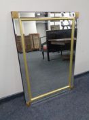 A contemporary glass framed bevelled mirror