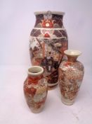 Three Japanese Satsuma vases, height 31.5 cm, 19.