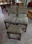 A set of four 20th century dining chairs upholstered in a tapestry fabric together with a similar