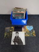 A box of vinyl LP's and 12" singles to include David Bowie, Prince,