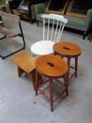 A painted Ibex chair together with three stools