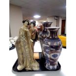 Two Japanese style blue and gilt vases and two figures of Geisha