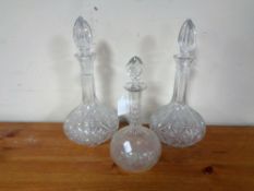 Three 20th century cut glass decanters