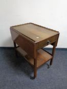 A 20th century pie crust edge flap sided tea trolley