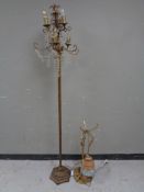 A gilt metal six way floor lamp with glass drops together with an antique gilt metal hanging light