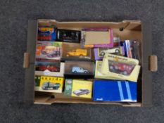 A box containing boxed die cast vehicles to include a Dinky Delahaye 145 Vanguards drop side truck,