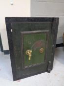 An antique metal safe with keys,