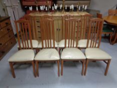 A set of eight Caxton high back rail back dining chairs