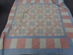 A stitched patchwork quilt