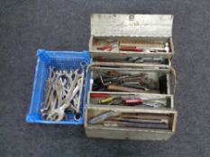 A metal concertina toolbox containing hand tools together with a basket containing ring spanners