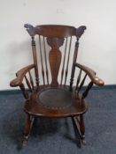 A 20th century carved beech rocking chair