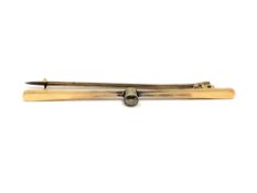 A 15ct gold bar brooch set with a diamond, approximately 0.2ct, 3.65g.